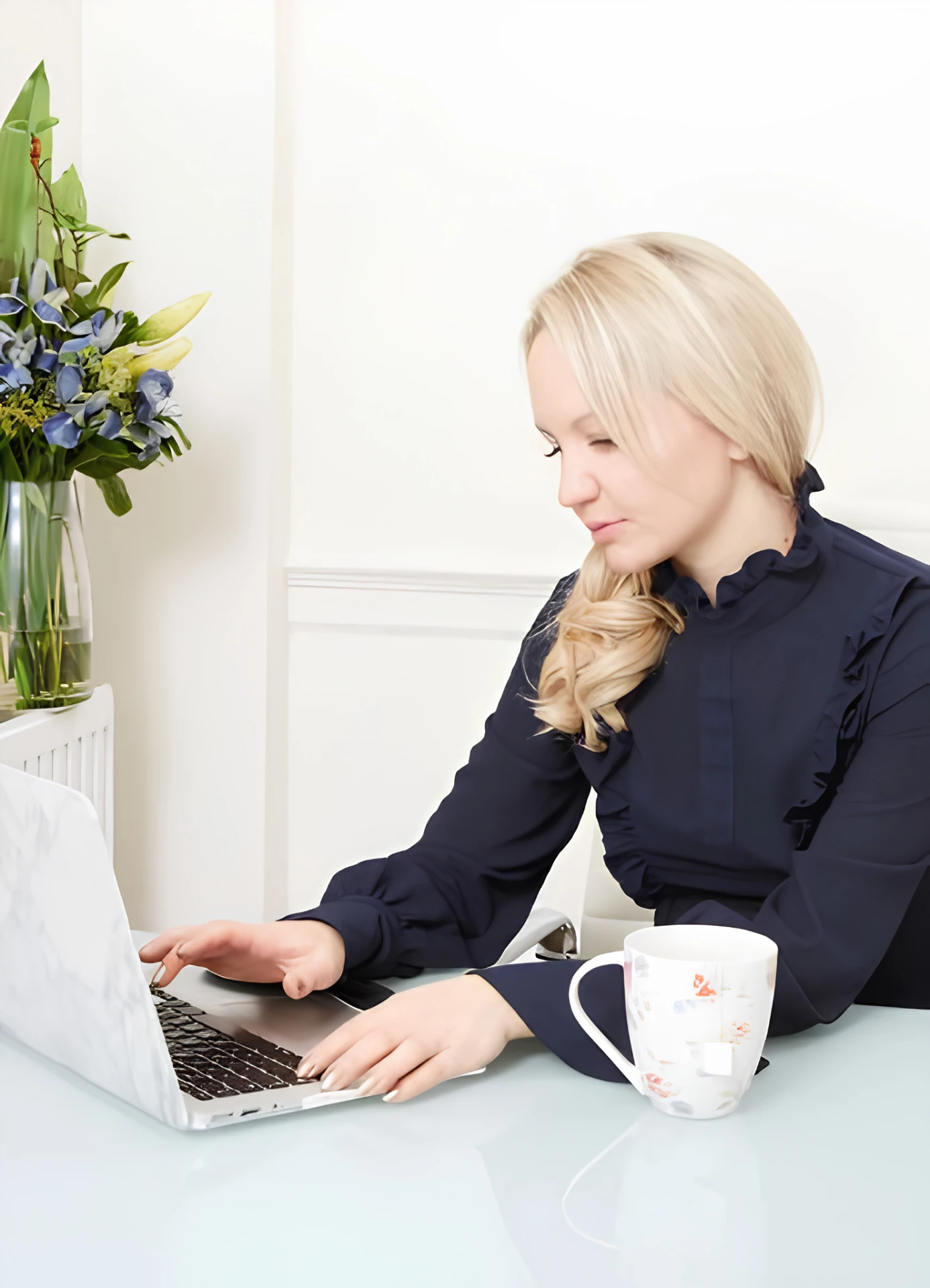 Kim Pearson working at her laptop
